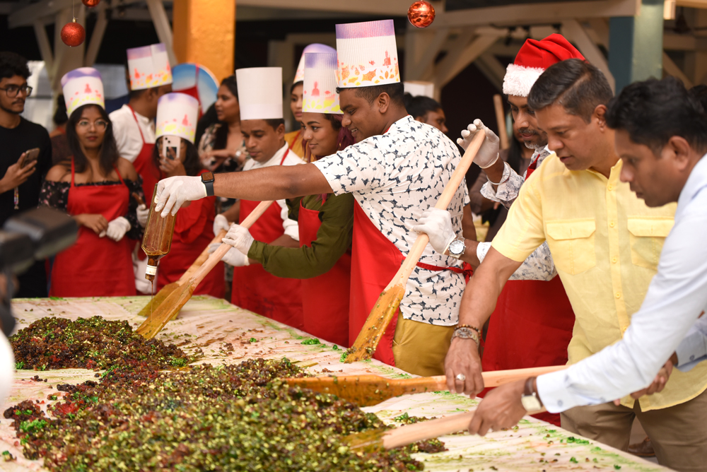 Dibyendu Barua and Sudarshan Chakravorty participate in Traditional Cake  Mixing Ceremony